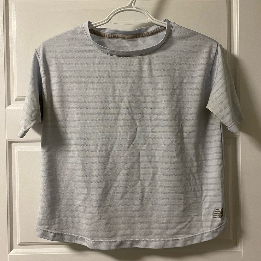 Women’s New Balance baby blue activewear t-shirt